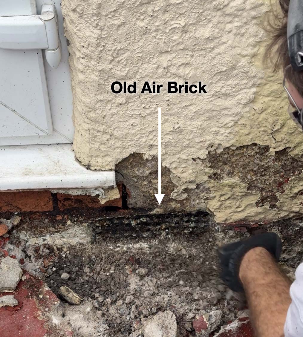 Finding an old blocked up air brick covered by old concrete patio steps